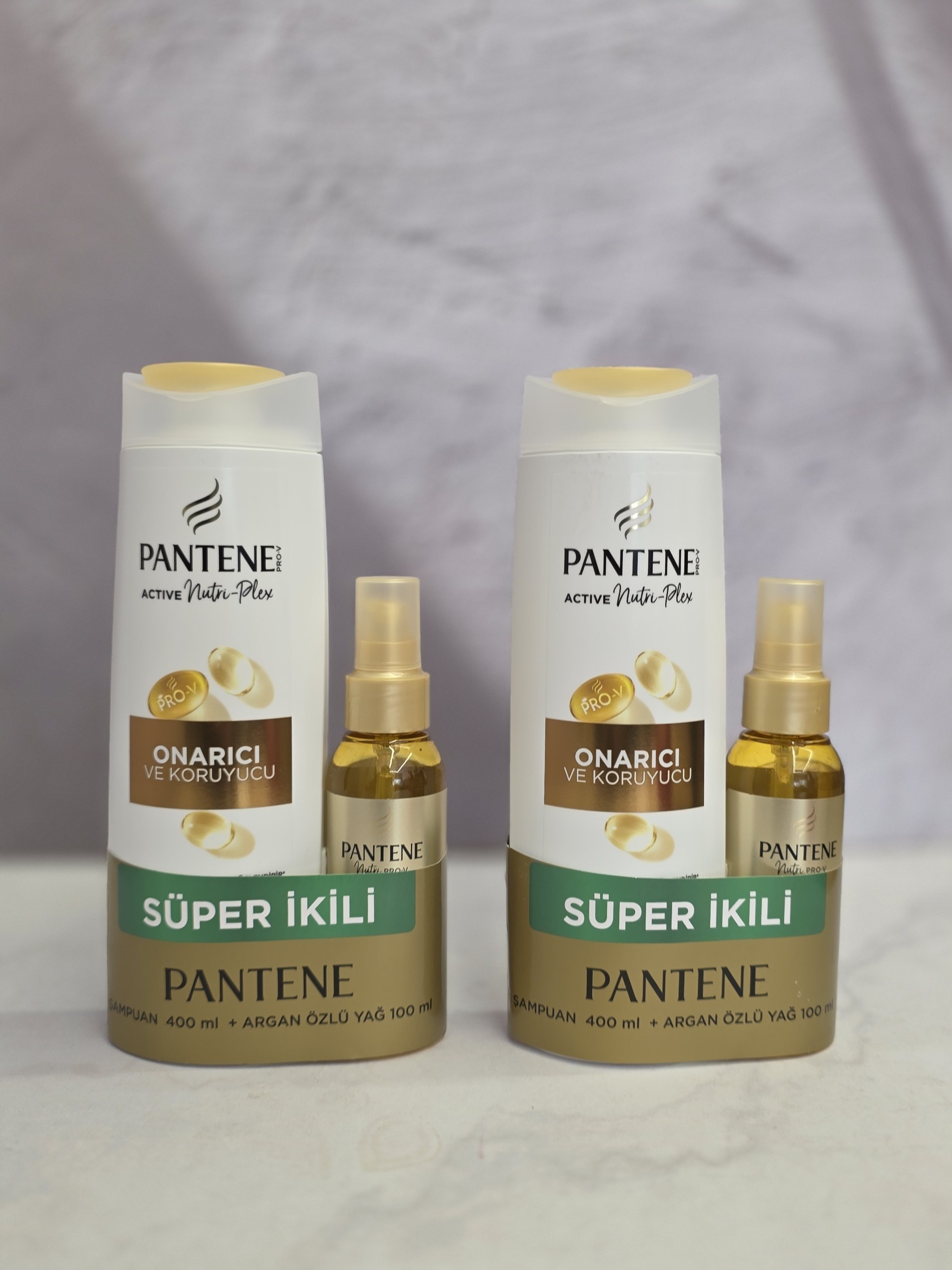پک مراقبت شامپو و روغن مو پنتن Pantene ترمیم کننده  آرگان 400 + 100 میل اصل اورجینال ( واردات قانونی از منطقه آزاد ارس )