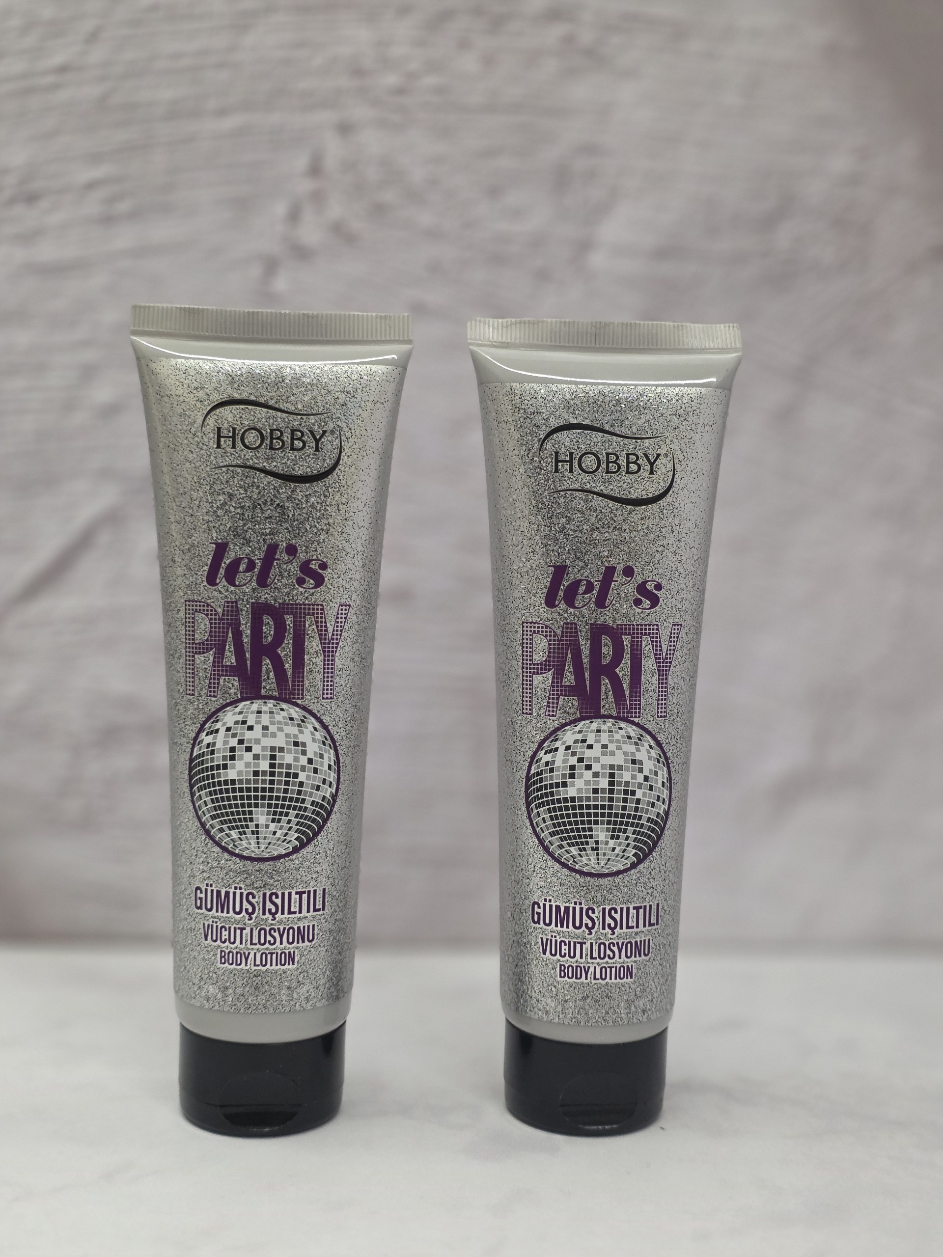 لوسیون بدن شاین دار و درخشان کننده هوبی Hobby مدل Let's Party با اکلیل و درخشش نقره حجم 150 میل اصل اورجینال ( واردات قانونی از منطقه آزاد ارس )